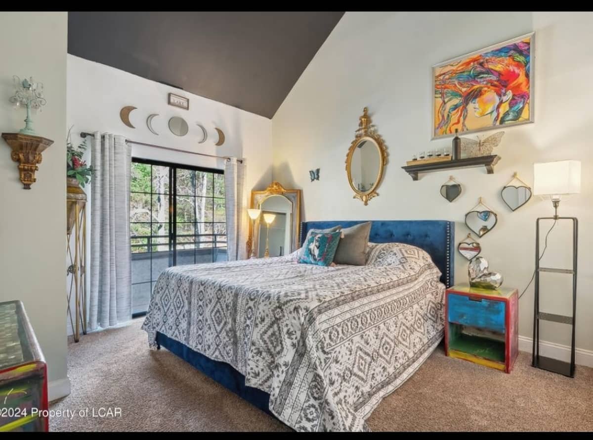 Bedroom 1 — king bed with balcony