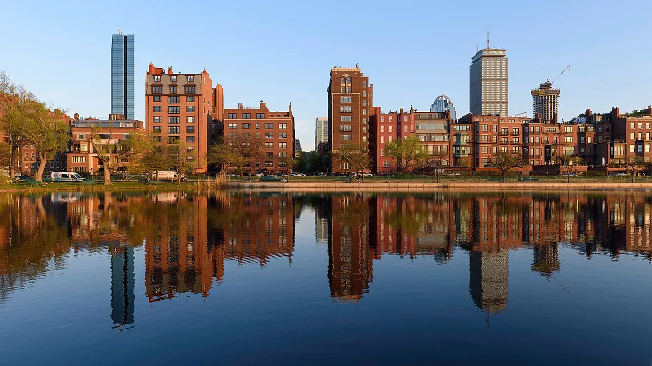 Back Bay brownstones and the Hancock tower mirrored in the Charles River lagoon