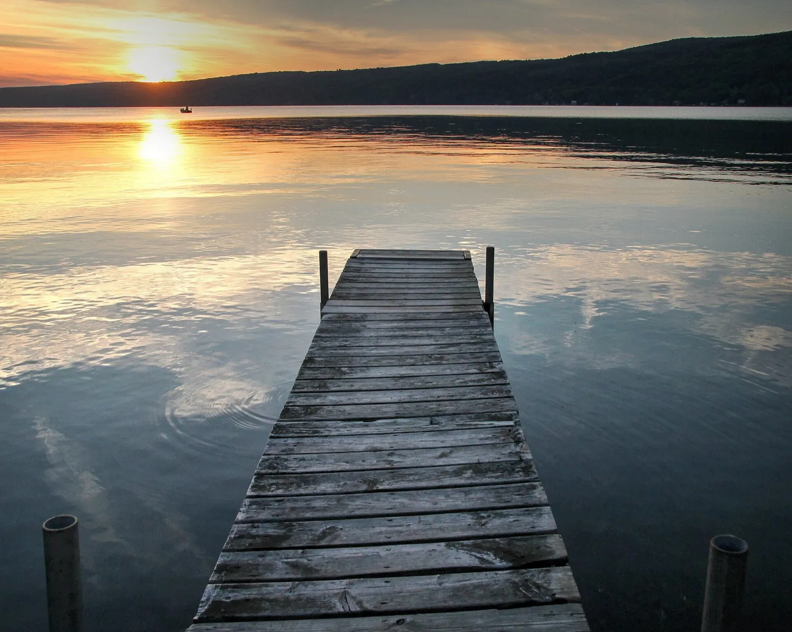 Sunset over a wooden dock on Keuka Lake