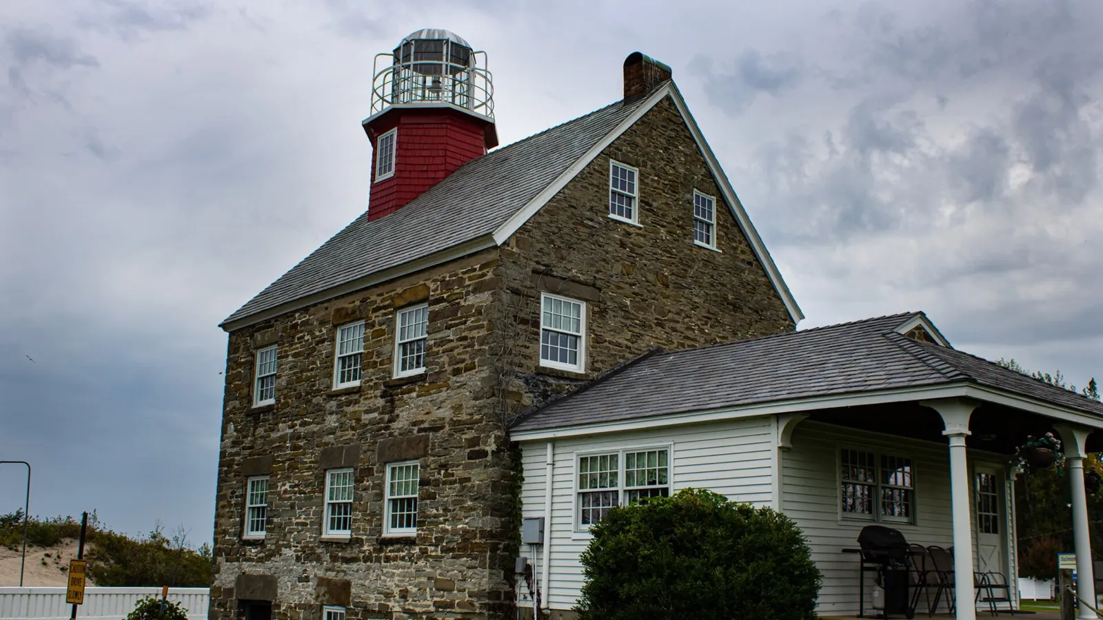 Selkirk Lighthouse with its red lantern room (nearby Selkirk Lighthouse, Port Ontario)