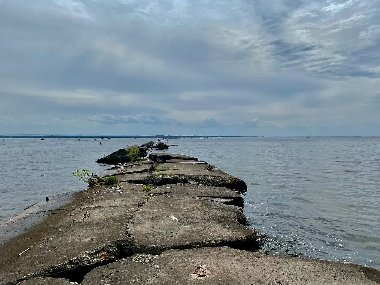 The breakwall at Sylvan Beach, New York delineates the entrance of the Erie Canal into Oneida Lake (left) from the lake proper (right).