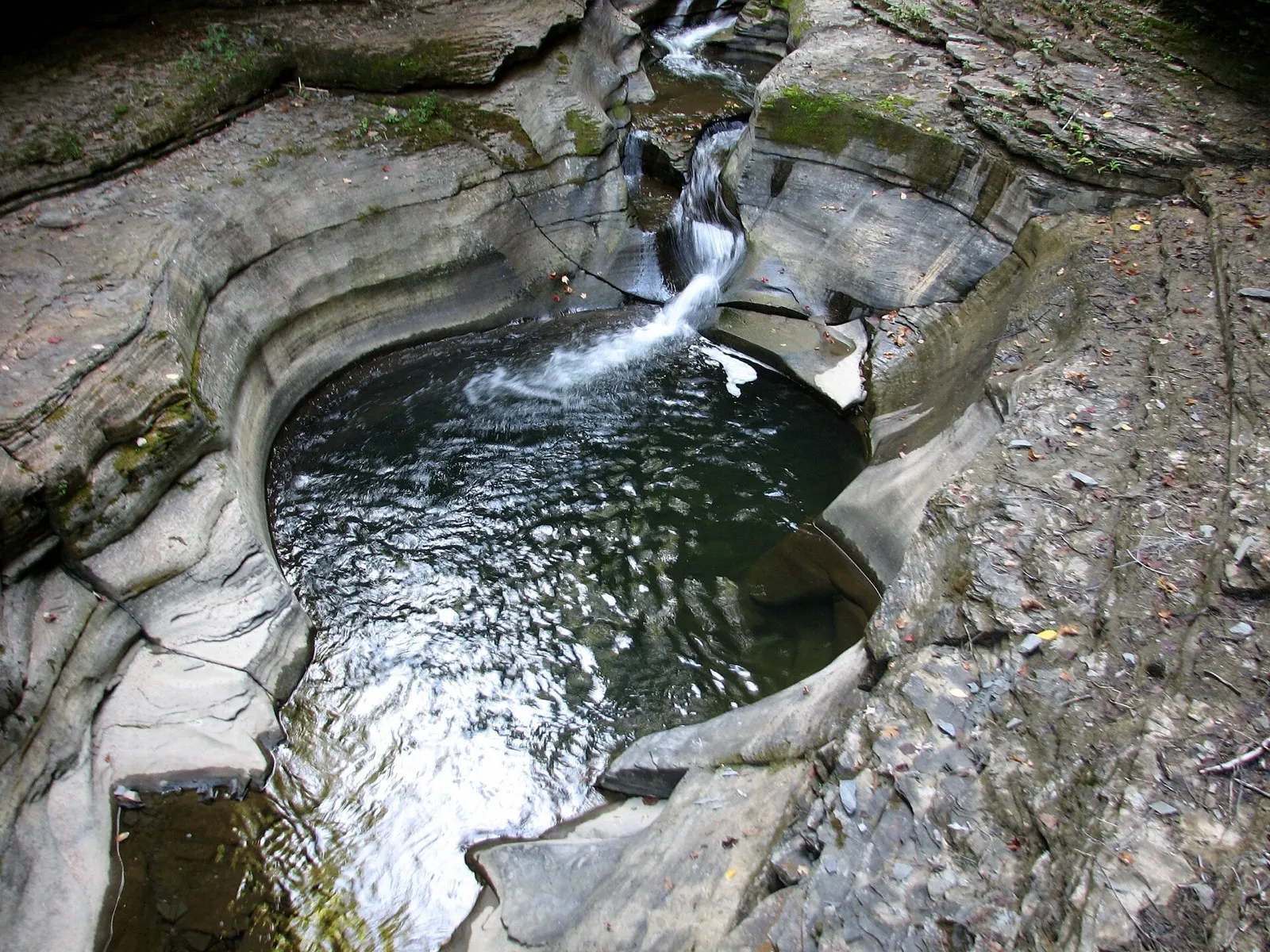 Swirling plunge pool carved in the Glen of Pools